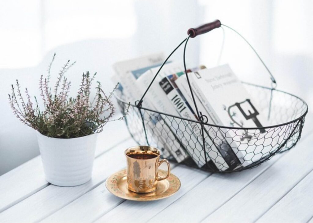 Image of basket of books and coffee for the "Keeping it Simple: Managing the Stress of Stuff" blog post