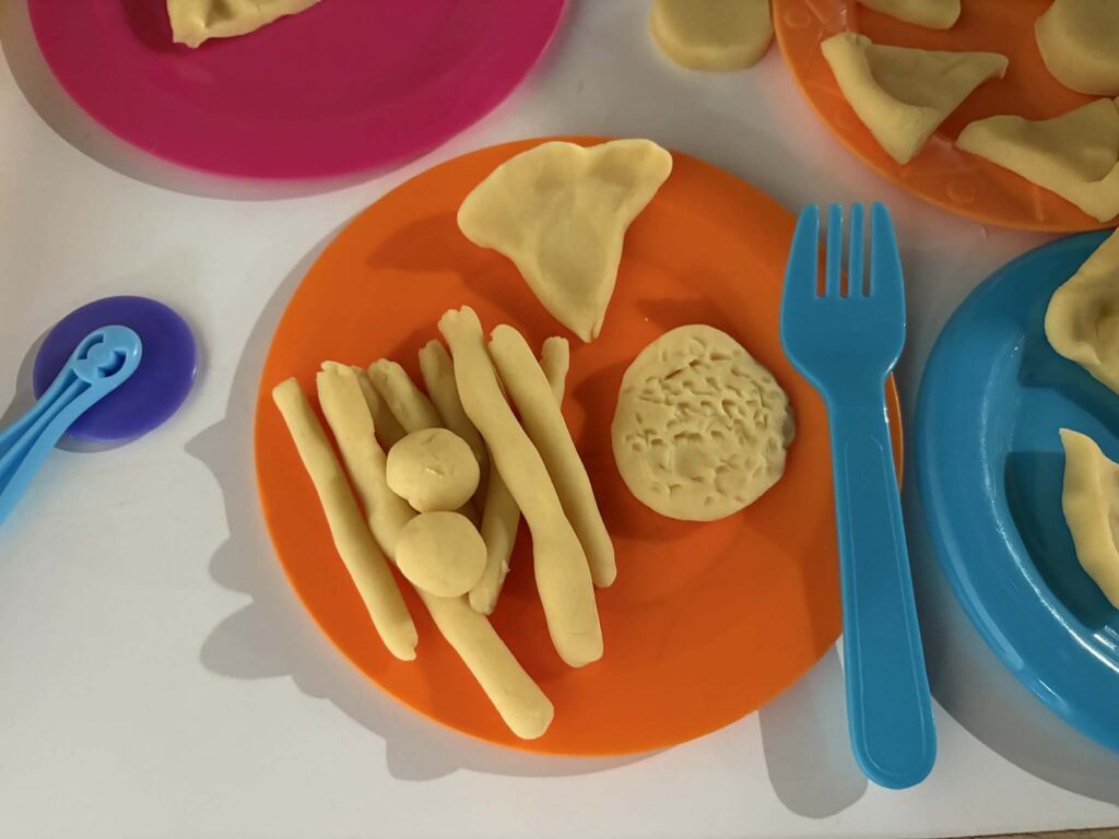 playdough as pretend food on plate