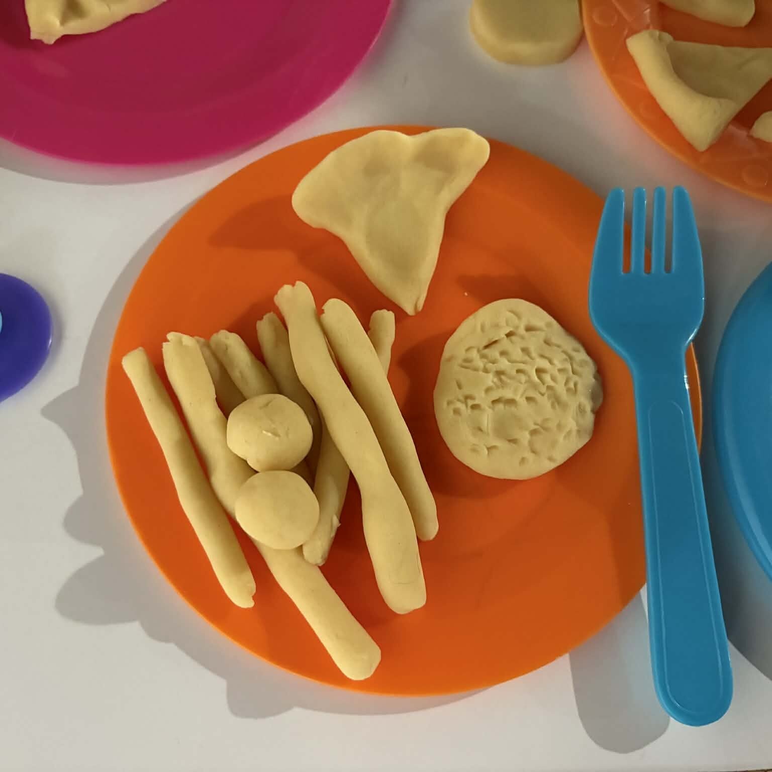 playdough as pretend food on plate